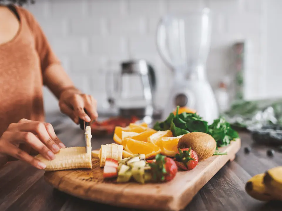 Woman preparing a healthy breakfast in the kitchen