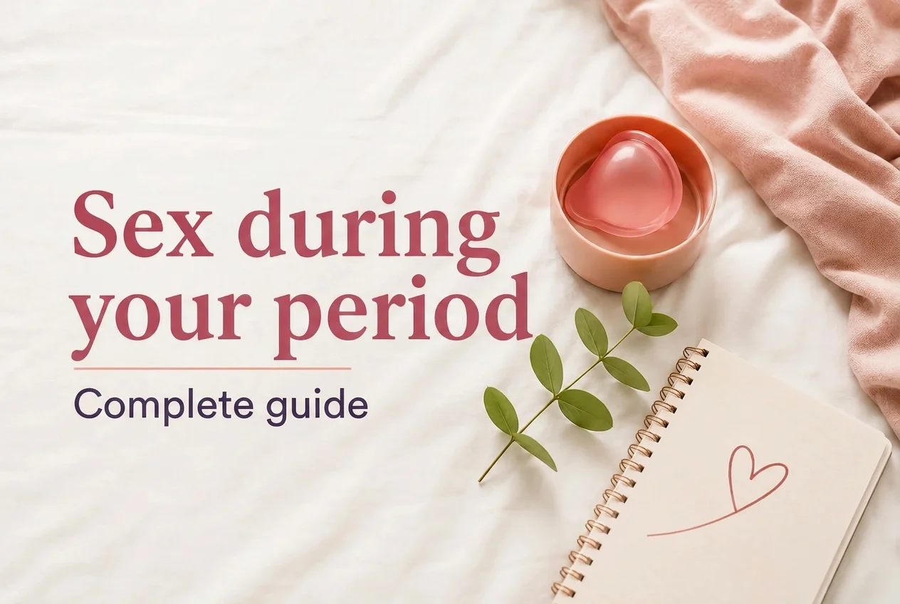 Text 'Sexo con la regla Guía completa' next to a pink menstrual cup, a green plant, and a notebook with a heart.
